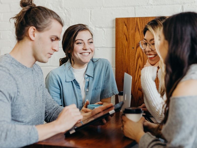 A counsellor discussing career options with students at a table